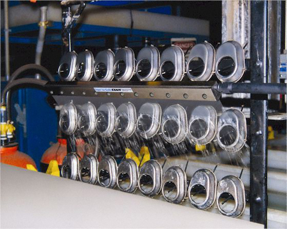 A Stainless Steel Super Air Knife dries bolt covers exiting an electro-polishing tank.